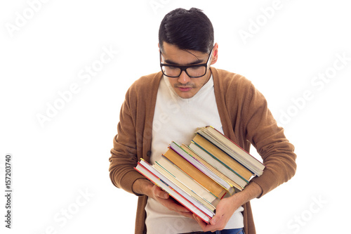 Young man in glasses with books