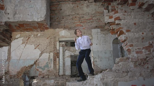 Boy dances in an abandoned house