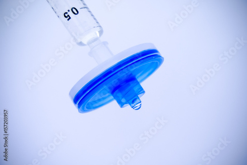 Water filtration, syringe filter isolated on white background photo