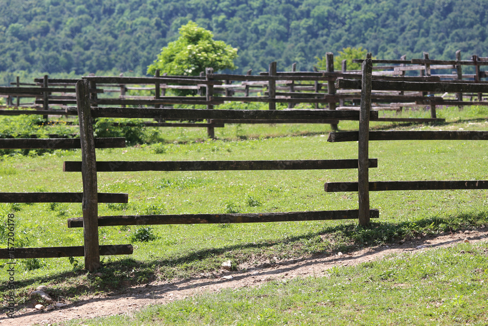 Empty corral against greeny mountain summertime Empty corral against greeny mountain summertime