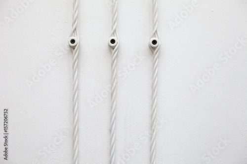 Vintage wiring on white wall, electric wire photo