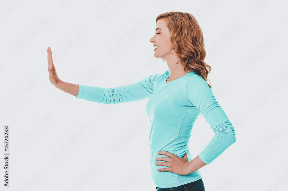 Side view woman pulling imaginary screen Side view woman pulling imaginary screen