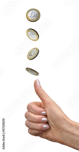 Woman's hand tosses a coin