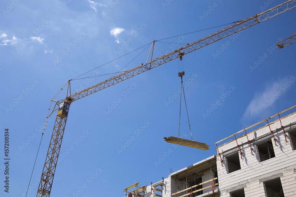 Industrial crane operating and lifting building materials