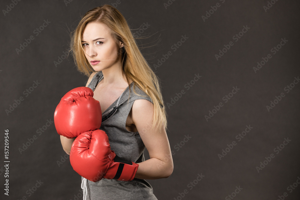 Beautiful woman with red boxing gloves Beautiful woman with red boxing gloves