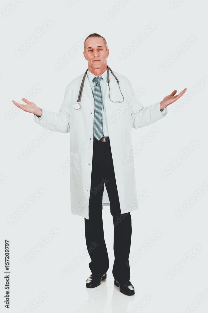 Mature male doctor holding copyspace Mature male doctor holding copyspace