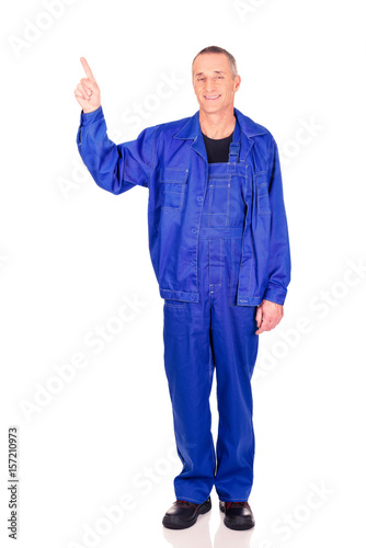 Smiling repairman pointing up