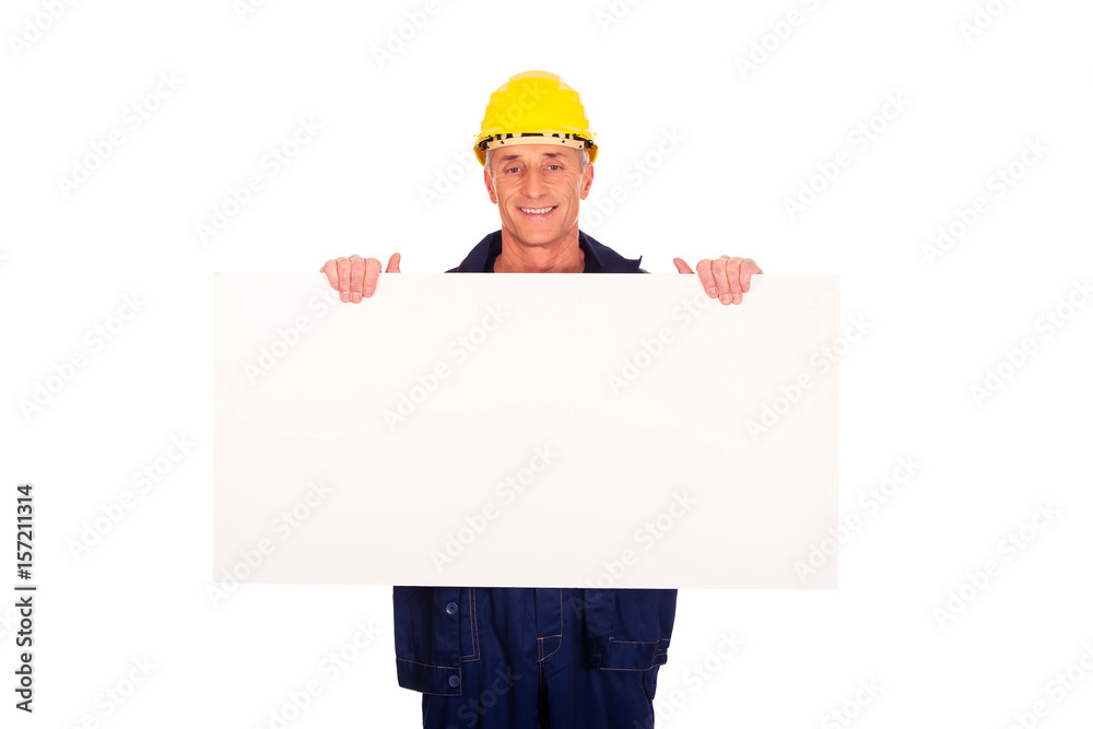 Happy worker presenting empty banner Happy worker presenting empty banner