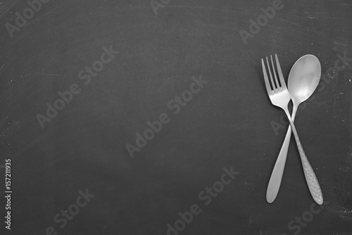 stainless steel spoon on black background.