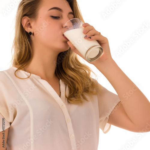 Young pretty girl, glass of milk, white background 