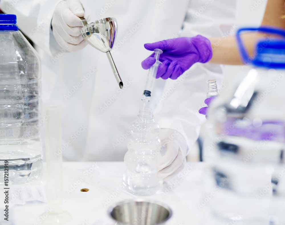 Lab technicians doing chemical analysis. Lab technicians doing chemical analysis.