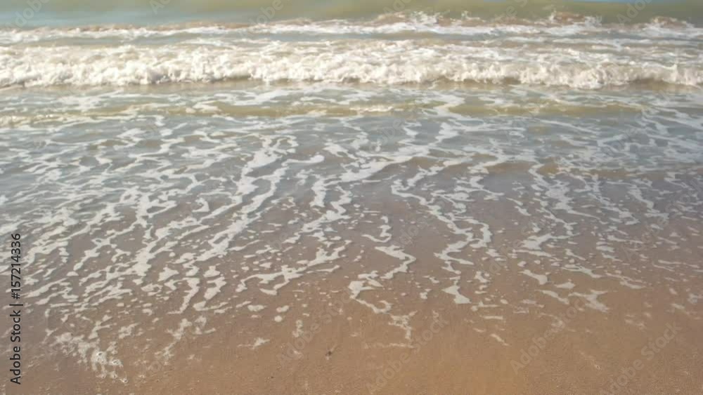 Small wave and sand.Water on the shore. Island amidst the ocean. Place to relax. Small wave and sand.Water on the shore. Island amidst the ocean. Place to relax.