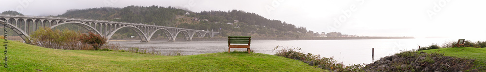 Fototapeta premium Rogue River Bridge Curry County Gold Beach Oregon Waterfront Bench