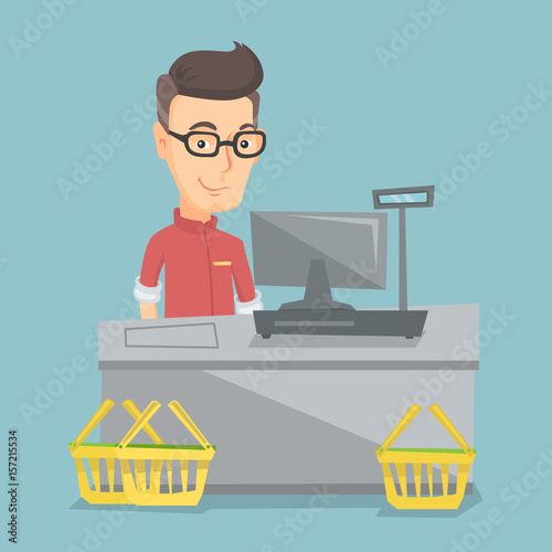 Cashier standing at the checkout in a supermarket.