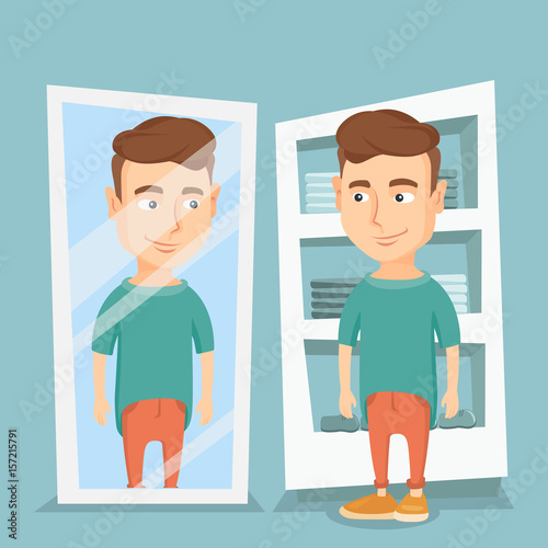 Man trying on t-shirt in a dressing room.