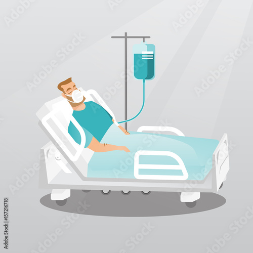 Patient lying in hospital bed with oxygen mask.