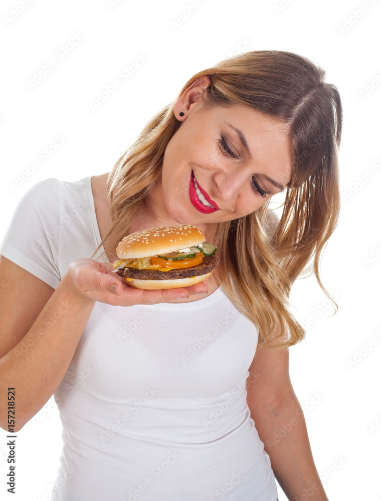 Pretty woman eating a delicious hamburger