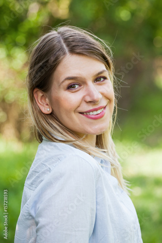 Gorgeous woman smiling at the camera outdoor