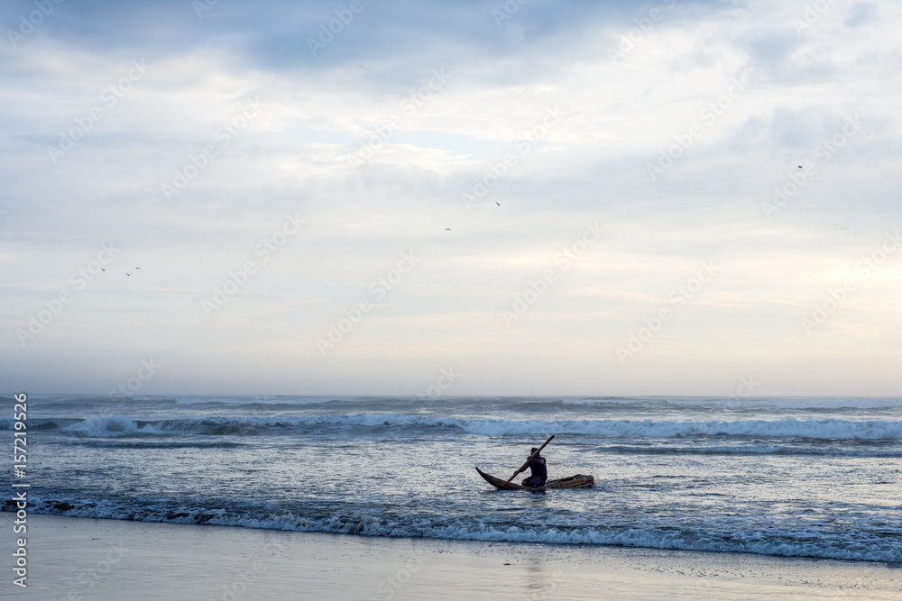 The fisherman goes to sea on a Traditional Peruvian small Reed Boats (Caballitos de Totora) in Pimentel, Peru The fisherman goes to sea on a Traditional Peruvian small Reed Boats (Caballitos de Totora) in Pimentel, Peru