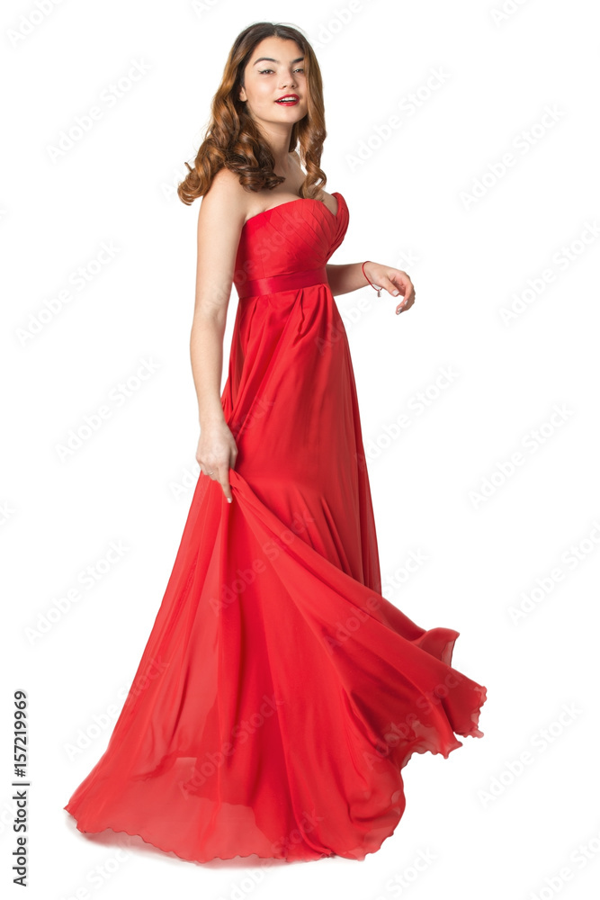 emotional Asian girl in red dress in full growth on an isolated background