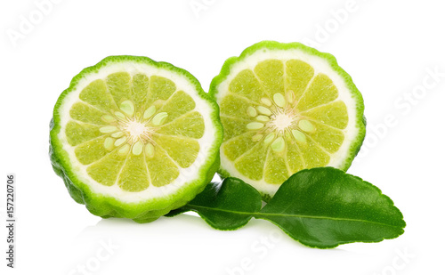 Half of bergamot fruit with leaf isolated on white background