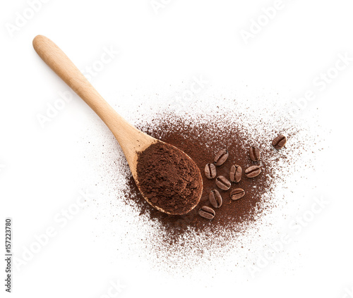 Wooden Spoon filled with coffee powder isolated on white background