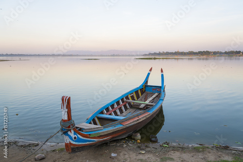 Wooden boat in Ubein Bridge at sunrise  Mandalay  Myanmar  World longest wooden bridge 