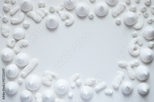 Meringues on white background form above. Copy space for text. Food, fashion or beauty blogger concept