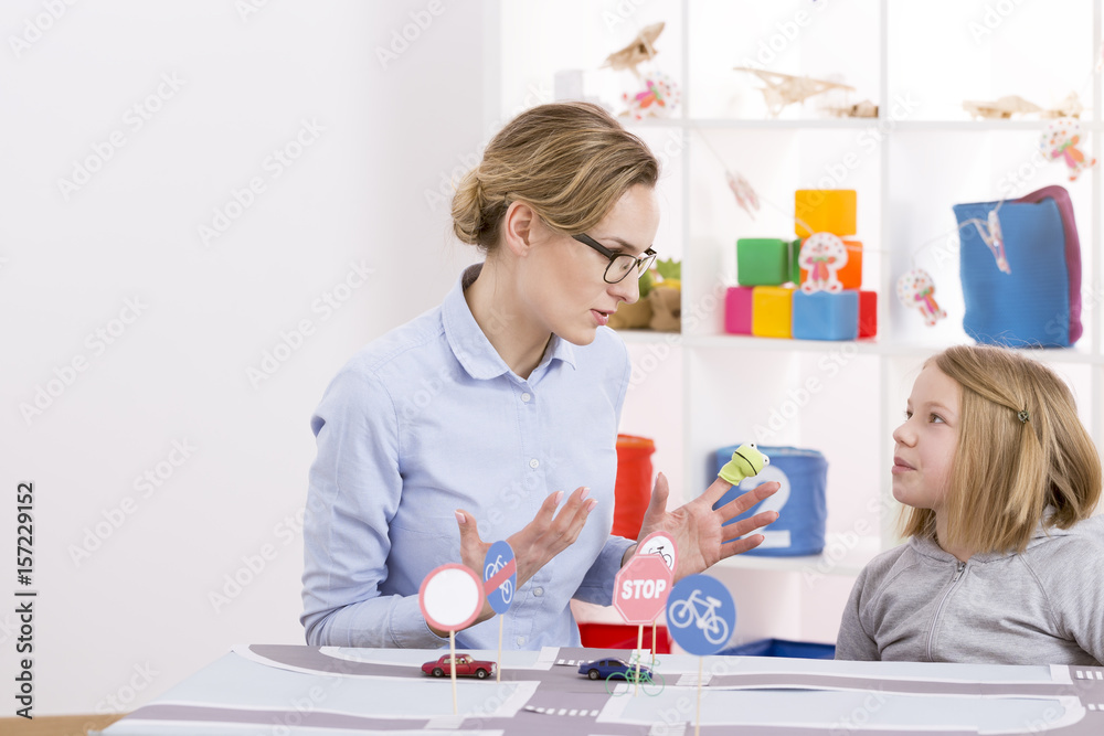 Child girl learning traffic regulations Child girl learning traffic regulations