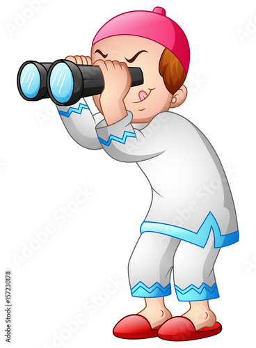 Happy muslim kid playing binoculars