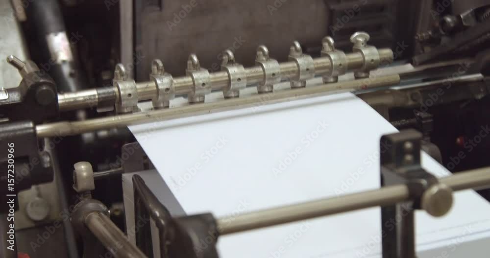 closeup of print machine tooks paper