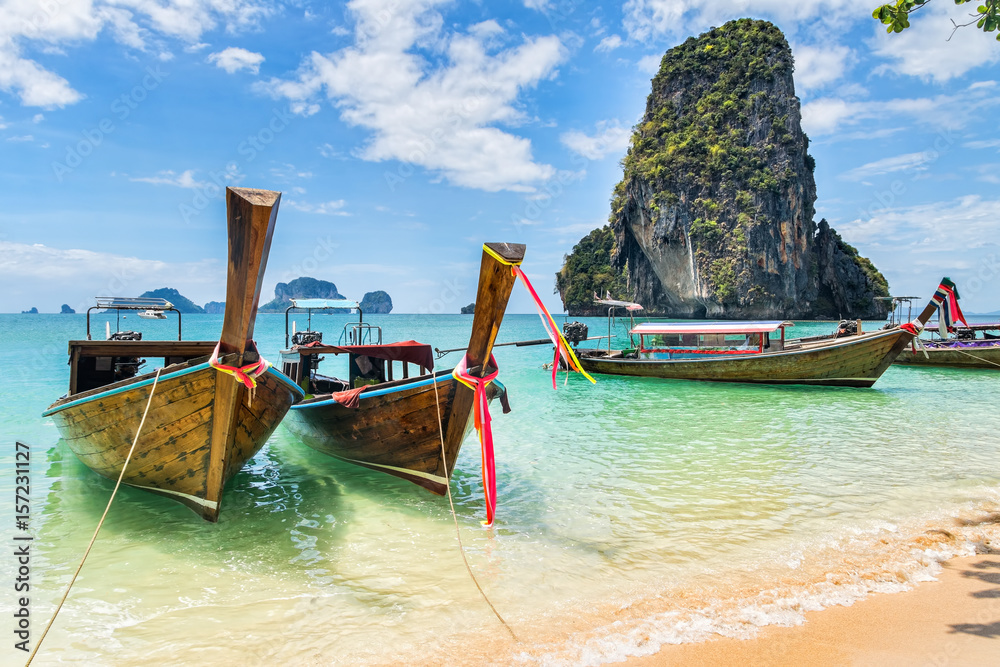 Amazing view of beautiful beach with longtale boats. Location: Railay beach, Krabi, Thailand, Andaman Sea. Artistic picture. Beauty world. Amazing view of beautiful beach with longtale boats. Location: Railay beach, Krabi, Thailand, Andaman Sea. Artistic picture. Beauty world.