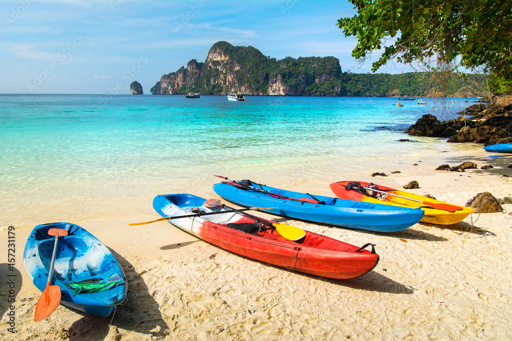 Amazing view of beautiful beach with kayaks on the sand. Location: Phi Phi Island, Krabi province, Thailand, Andaman Sea. Artistic picture. Beauty world. Amazing view of beautiful beach with kayaks on the sand. Location: Phi Phi Island, Krabi province, Thailand, Andaman Sea. Artistic picture. Beauty world.