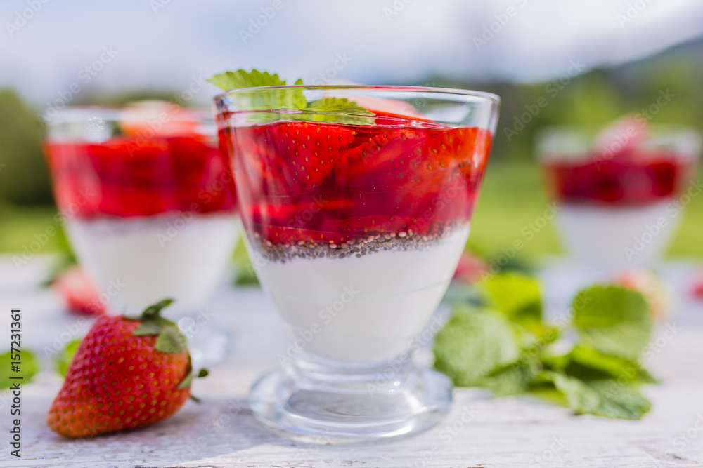 Yogurt with chia seeds and jelly and fresh strawberries. Yogurt with chia seeds and jelly and fresh strawberries.