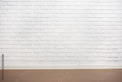 white brick wall with tiled floor  abstract background photo