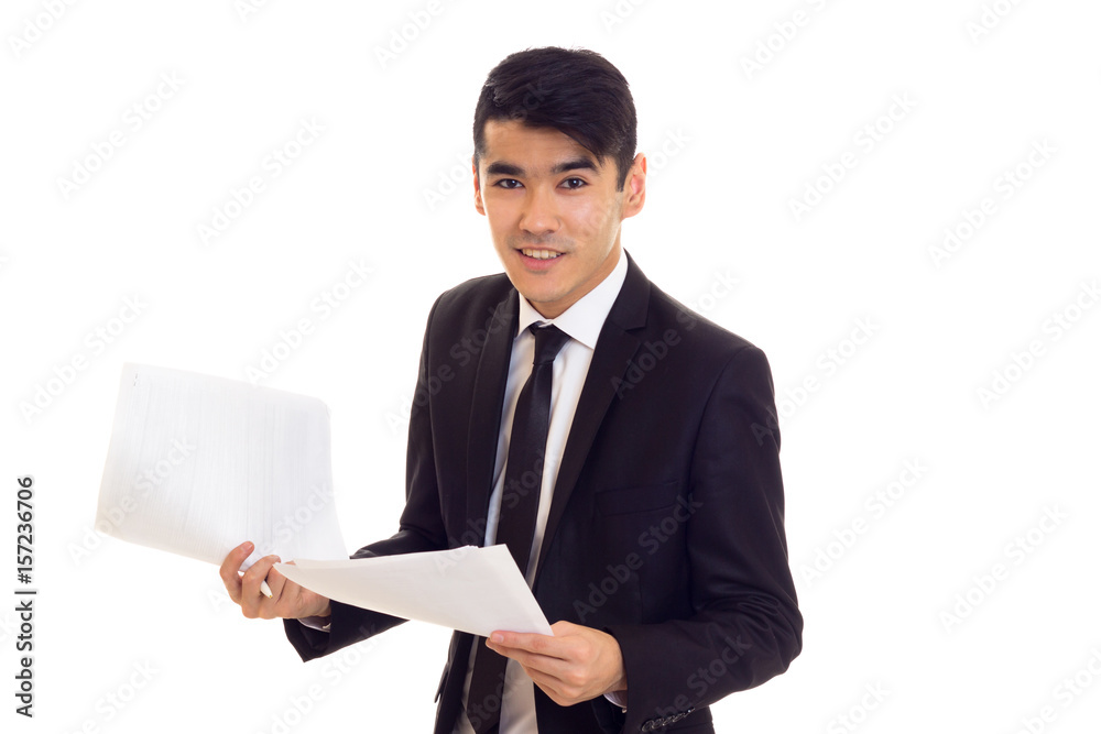 Young man in suit holding papers Young man in suit holding papers