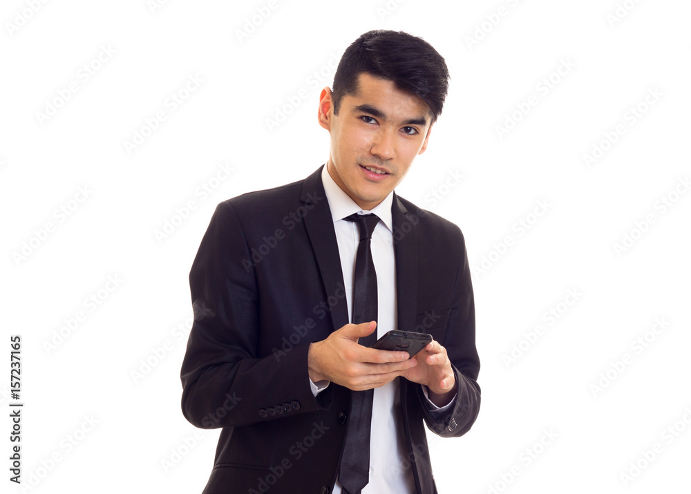 Young man in suit talking on the phone Young man in suit talking on the phone