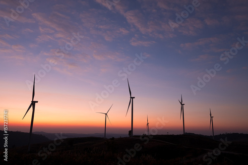Windmills for electric power production on mountain photo
