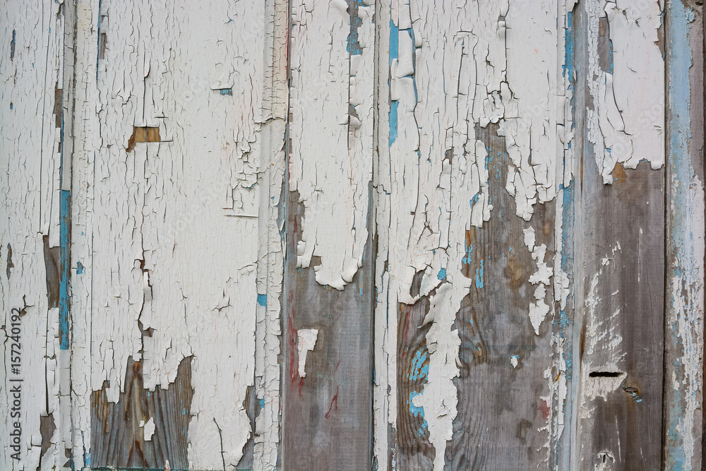 White cracked painting on wooden surface White cracked painting on wooden surface