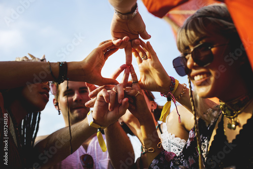 Friends Making Hands as Peace Sign Together photo