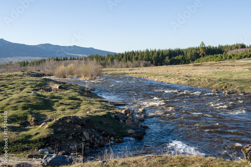 A mountain river flows next to the village
