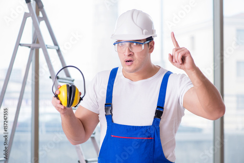 Young worker with noise cancelling headphones
