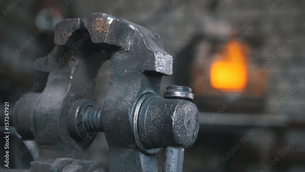Inside forge workshop - steel vise, slider shot Inside forge workshop - steel vise, slider shot