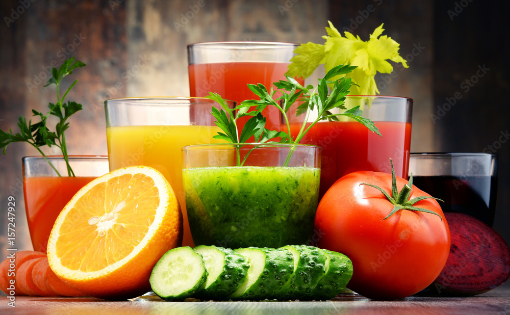 Glasses with fresh organic vegetable and fruit juices Glasses with fresh organic vegetable and fruit juices