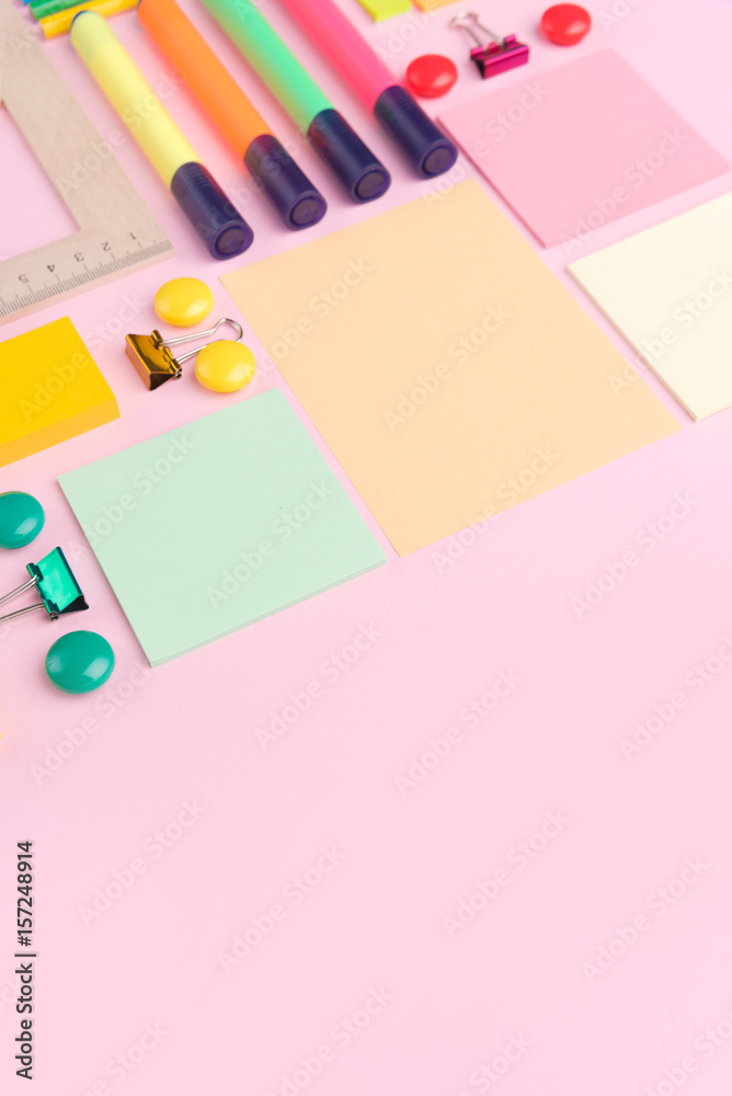 Office supplies on the pink background table