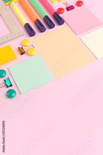 Office supplies on the pink background table