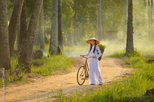 Beautiful  woman with Vietnam culture traditional dress,traditional costume ,vintage style,Vietnam photo