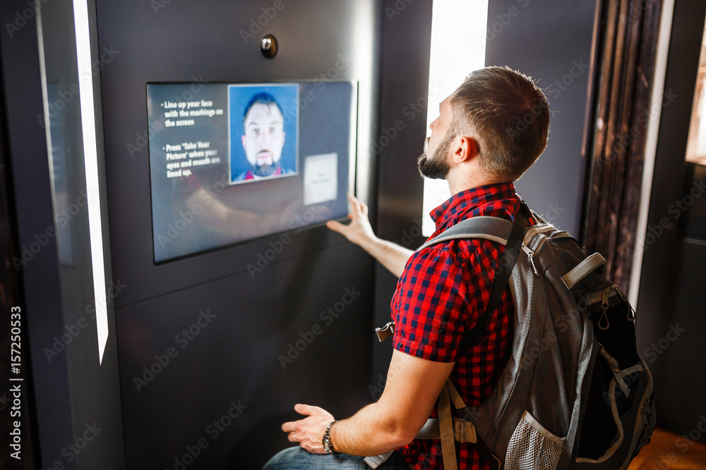 Poster A man undergoes an access control procedure using the ...