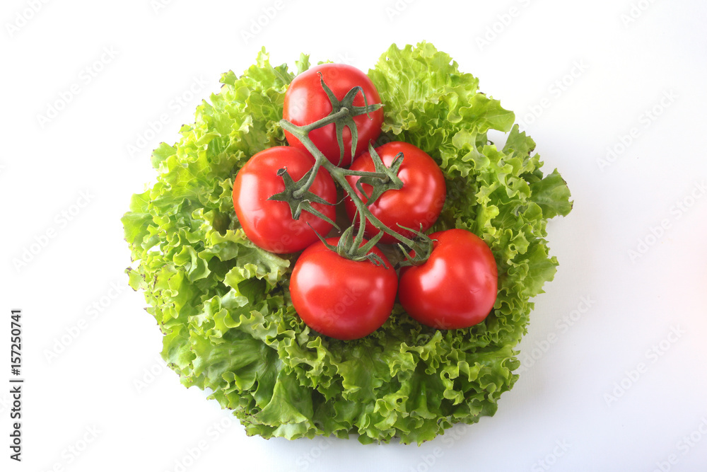 Fresh assorted vegetables with leaf lettuce. Isolated on white background. Selective focus. Fresh assorted vegetables with leaf lettuce. Isolated on white background. Selective focus.