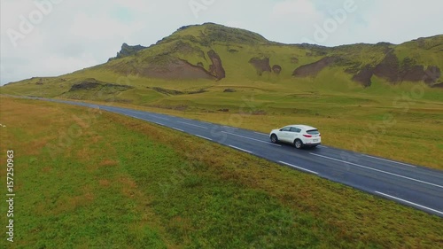 4K UHD Green dear in Iceland. Car in road